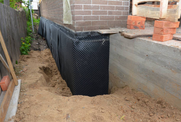 Happy homeowners after waterproofing job in Corunna